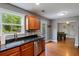 Bright eat-in kitchen featuring stainless steel appliances, granite countertops and hardwood floors at 3374 Dunwick Dr, Johns Island, SC 29455