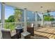Relax on this spacious balcony with comfortable seating around a fire pit table and neighborhood views at 339 Clayton Dr, Charleston, SC 29414