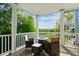 Relax on this private balcony with comfortable seating around a fire pit table and beautiful neighborhood views at 339 Clayton Dr, Charleston, SC 29414
