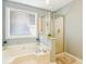 Serene bathroom with a soaking tub and glass-enclosed shower at 339 Clayton Dr, Charleston, SC 29414