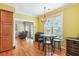 Bright dining area with hardwood floors, modern light fixture, and easy access to the porch at 339 Clayton Dr, Charleston, SC 29414