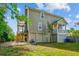 Multi-story home with a wooden deck and mature landscaping at 339 Clayton Dr, Charleston, SC 29414