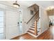 Inviting foyer with hardwood floors, white wainscoting, and a staircase leading to the upper level at 339 Clayton Dr, Charleston, SC 29414