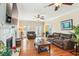 Bright living room featuring a fireplace, hardwood floors, and a view to an adjoining room at 339 Clayton Dr, Charleston, SC 29414