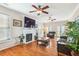 Well-lit living room with hardwood floors, a fireplace, and an open layout with windows at 339 Clayton Dr, Charleston, SC 29414