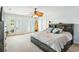 Spacious bedroom with large windows, a ceiling fan, and rustic wood furnishings at 339 Clayton Dr, Charleston, SC 29414