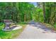 Well-maintained walking path with a bench surrounded by lush greenery at 339 Clayton Dr, Charleston, SC 29414