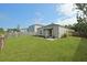 Enjoy the outdoor space with a covered patio, garden beds, and lush green lawn, creating a private retreat at 341 Matuskovic Dr, Charleston, SC 29414