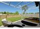 Grassy backyard featuring a patio, outdoor seating, and a garden bed at 341 Matuskovic Dr, Charleston, SC 29414
