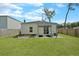 The backyard has a covered patio, custom garden beds, and a well-manicured lawn, perfect for outdoor activities at 341 Matuskovic Dr, Charleston, SC 29414
