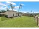 The backyard has a covered patio, garden beds, and a well-manicured lawn, perfect for outdoor living at 341 Matuskovic Dr, Charleston, SC 29414
