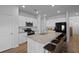 Bright kitchen features an island with bar seating, granite countertops and stainless steel appliances at 341 Matuskovic Dr, Charleston, SC 29414