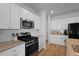 Updated kitchen with stainless steel appliances, tile backsplash, and white cabinetry at 341 Matuskovic Dr, Charleston, SC 29414
