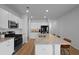 Well-lit kitchen featuring an island with a sink, updated appliances, and hardwood floors at 341 Matuskovic Dr, Charleston, SC 29414