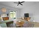 Bright living room with a large TV, sliding glass doors, and a decorative rug at 341 Matuskovic Dr, Charleston, SC 29414