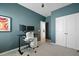 Contemporary office with a dual monitor setup, white rolling chair, and a closet at 341 Matuskovic Dr, Charleston, SC 29414