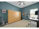 Office with a wooden murphy bed, a desk, guitars, and a window at 341 Matuskovic Dr, Charleston, SC 29414