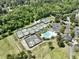 Aerial view of The Club at Pine Forest, featuring golf course, tennis courts, swimming pool, and clubhouse at 347 Prestwick Ct, Summerville, SC 29483