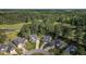 Stunning aerial view of homes backing up to golf course and pond, surrounded by lush trees at 347 Prestwick Ct, Summerville, SC 29483