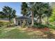 Backyard showcasing well-maintained landscaping, patio area with furniture, and a partially visible house at 347 Prestwick Ct, Summerville, SC 29483