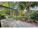 Cozy backyard featuring a custom pergola, landscaped area, string lights, and potted plants at 347 Prestwick Ct, Summerville, SC 29483