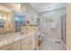 Bright bathroom featuring dual vanities, tiled floors, and a separate glass-enclosed shower at 347 Prestwick Ct, Summerville, SC 29483