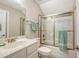 Bathroom features a vanity, toilet, and a shower-tub combo with glass doors at 347 Prestwick Ct, Summerville, SC 29483