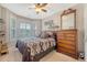 Cozy bedroom featuring a comfortable bed, large window, and a stylish dresser at 347 Prestwick Ct, Summerville, SC 29483