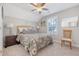 Cozy bedroom with a floral bedspread, a window view, and comforting natural light at 347 Prestwick Ct, Summerville, SC 29483
