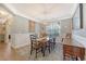 Elegant dining room with stylish light fixture and plenty of natural light at 347 Prestwick Ct, Summerville, SC 29483