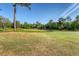 Scenic view of a lush golf course with mature trees and clear blue skies at 347 Prestwick Ct, Summerville, SC 29483