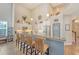 Spacious open kitchen with granite countertop bar, stainless steel appliances, and modern lighting at 347 Prestwick Ct, Summerville, SC 29483