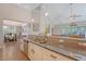 Open kitchen with granite countertops, stainless steel appliances, and views of the dining and living areas at 347 Prestwick Ct, Summerville, SC 29483