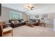 Inviting living room with plush seating, natural light, and ceiling fan for added comfort at 347 Prestwick Ct, Summerville, SC 29483