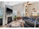 Comfortable living room with a fireplace, tv, and an open floor plan with view of kitchen at 347 Prestwick Ct, Summerville, SC 29483