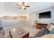 Spacious living room with a ceiling fan, television, and comfortable seating for relaxing at 347 Prestwick Ct, Summerville, SC 29483