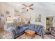 Open concept floor plan featuring the living room, kitchen, and dining area with a large comfortable sofa at 347 Prestwick Ct, Summerville, SC 29483