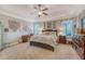 Serene primary bedroom features tray ceilings, natural light and a comfortable layout at 347 Prestwick Ct, Summerville, SC 29483