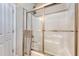 Shower with glass door, tile surround, and a towel bar, showcasing functionality at 347 Prestwick Ct, Summerville, SC 29483