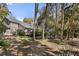 Charming home with a spacious backyard, a deck perfect for entertaining, and mature trees for a private, tranquil setting at 3510 Deer Run Rd, Seabrook Island, SC 29455