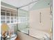 Bathroom with a shower/tub combo and glass block window at 3510 Deer Run Rd, Seabrook Island, SC 29455