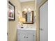 Powder room with white vanity, ornate mirror, and decorative lighting at 3510 Deer Run Rd, Seabrook Island, SC 29455
