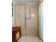 Accessible bathroom with tiled floors and glass shower doors with safety grab bars at 3510 Deer Run Rd, Seabrook Island, SC 29455