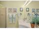 Bathroom with a single sink vanity, framed nautical prints, and a walk-in shower at 3510 Deer Run Rd, Seabrook Island, SC 29455