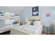 Comfortable bedroom with a white bed, bunkbeds, and vaulted ceilings at 3510 Deer Run Rd, Seabrook Island, SC 29455
