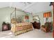 Spacious bedroom with natural lighting, four poster bed, and traditional furnishings at 3510 Deer Run Rd, Seabrook Island, SC 29455