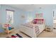 Nautical themed bedroom with a white bed, wicker chair, and blue walls at 3510 Deer Run Rd, Seabrook Island, SC 29455
