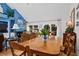 Dining room with a hardwood table, wooden chairs, and views into the living room at 3510 Deer Run Rd, Seabrook Island, SC 29455