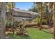 Charming two-story home featuring a well-maintained lawn, mature trees, and a spacious deck at 3510 Deer Run Rd, Seabrook Island, SC 29455
