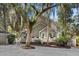 Attractive home with a well-manicured yard, a front porch, and a blue door at 3510 Deer Run Rd, Seabrook Island, SC 29455